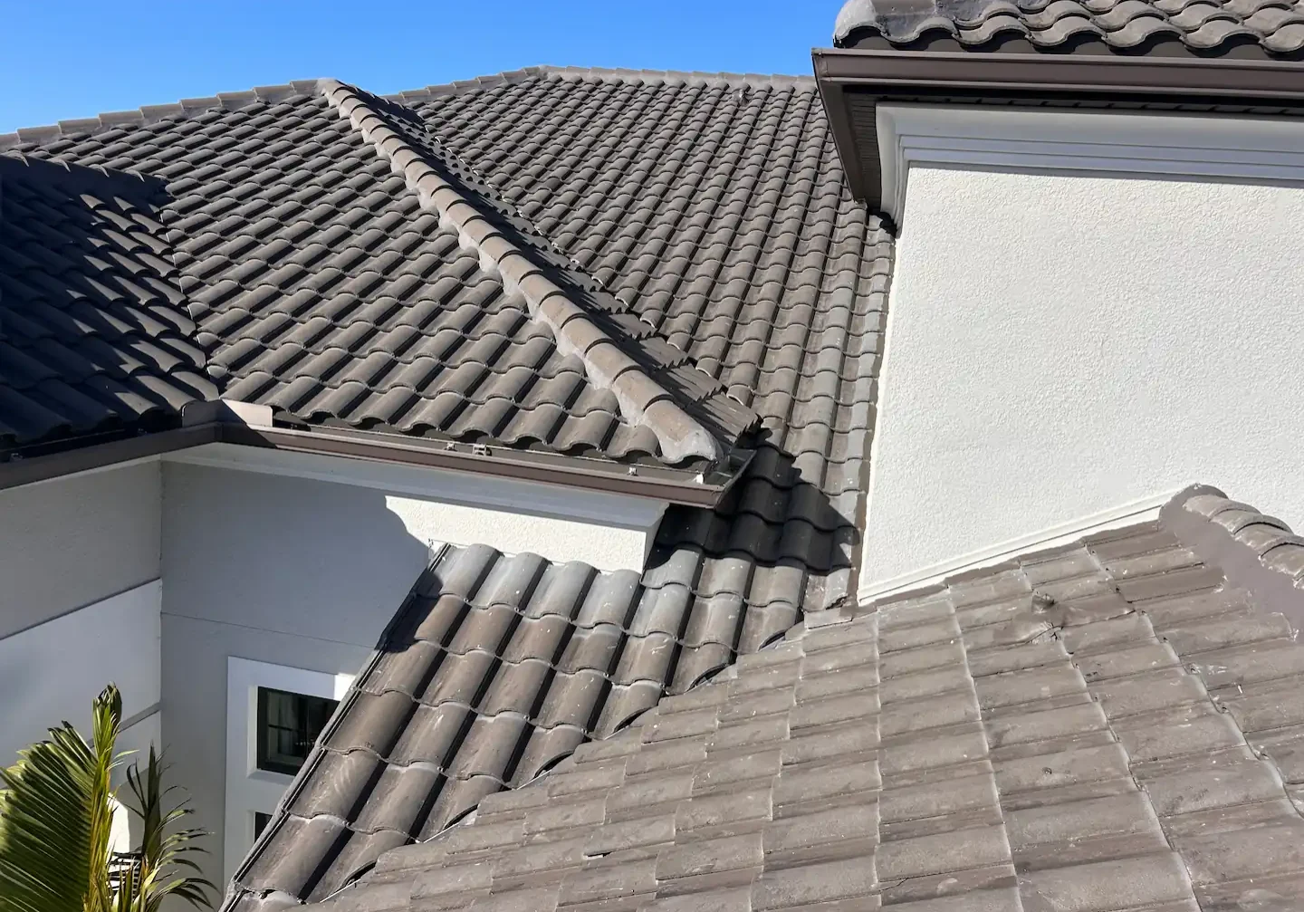 Rooftop photo of a modern warm grey clay tile roof